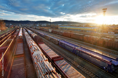 Canvas Print Railway at sunset with cargo trains.