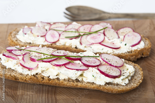 bread with cream robiola cheese and radishes