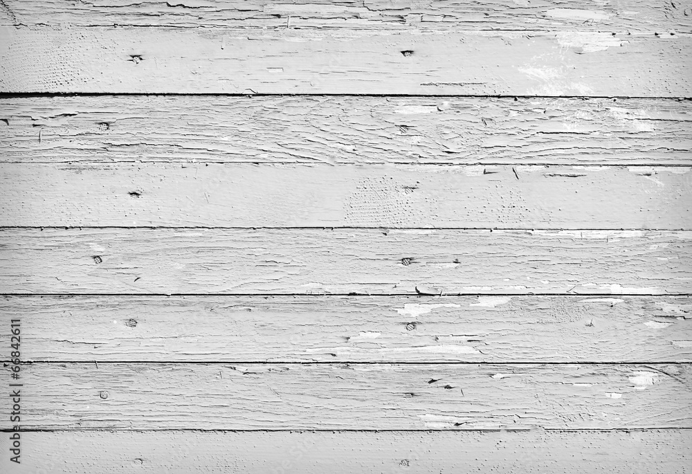 Fototapeta premium Weathered wood background with peeling white paint features horizontal distressed planks in monochrome tones for rustic backdrop design, vintage overlay, or surface texture mockup
