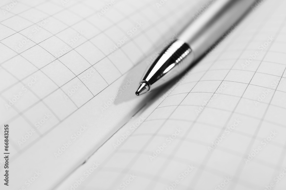 Pen on opened book, close up Pen on opened book, close up