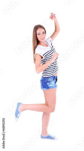 Beautiful young girl in shorts and t-shirt isolated on white