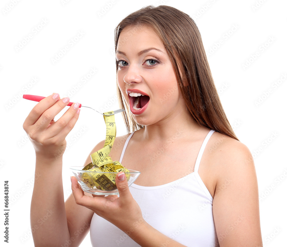 Beautiful girl with measuring tape in bowl, isolated on white Beautiful girl with measuring tape in bowl, isolated on white