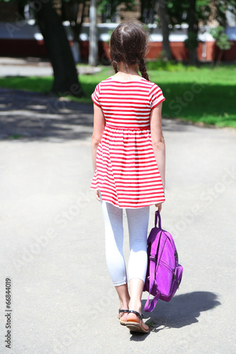 Cute girl with backpack in ...