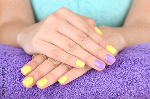 Female hand with stylish colorful nails 