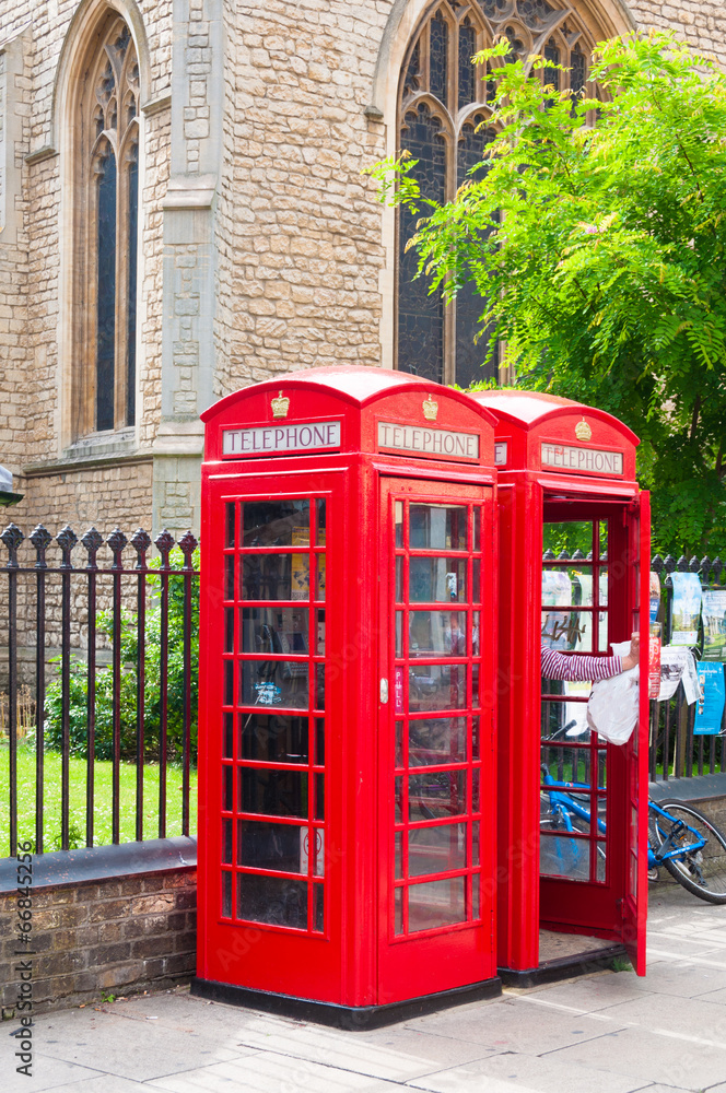 Red BT telephone boxes in Cambridge, UK Red BT telephone boxes in Cambridge, UK