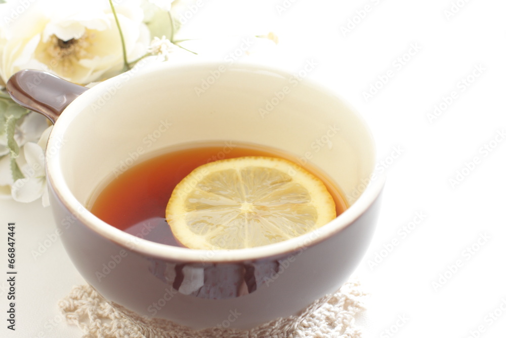 Lemon tea with flower on background Lemon tea with flower on background