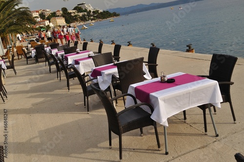 Tables and chairs of restaurant in port of Podgora  Croatia
