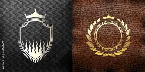 set of two coats of arms on a leather background