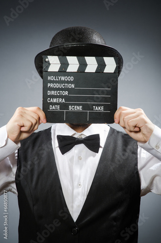 фотографія Funny man with movie clapper board