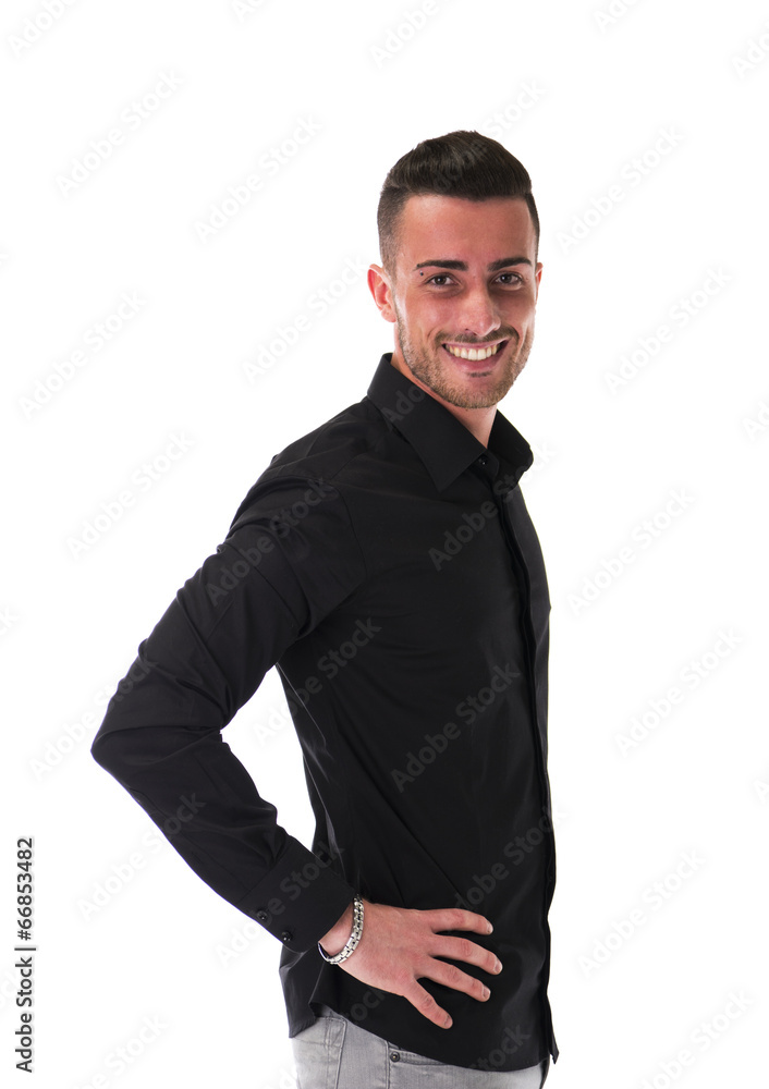 Fototapeta premium Smiling young man in black shirt, looking at camera