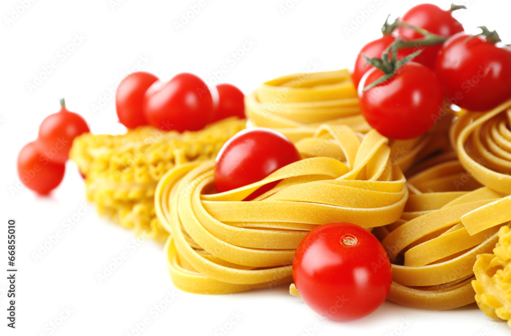 Raw homemade pasta and tomatoes, isolated on white Raw homemade pasta and tomatoes, isolated on white