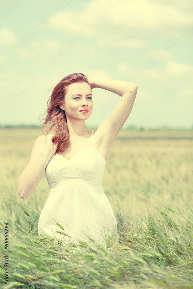 Beautiful young woman in field Beautiful young woman in field