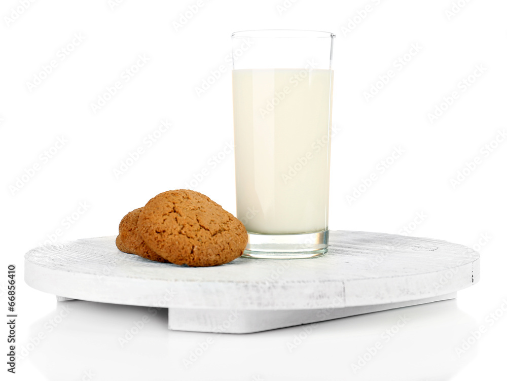 Milk and cookies on wooden tray isolated on white Milk and cookies on wooden tray isolated on white