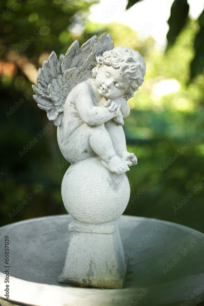 close up angel doll in garden