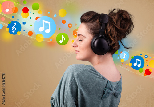 Young woman listening to music with headphones