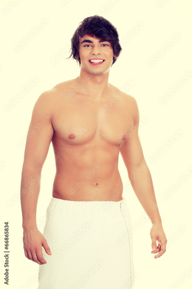Handsome, happy young man with the towel. Handsome, happy young man with the towel.
