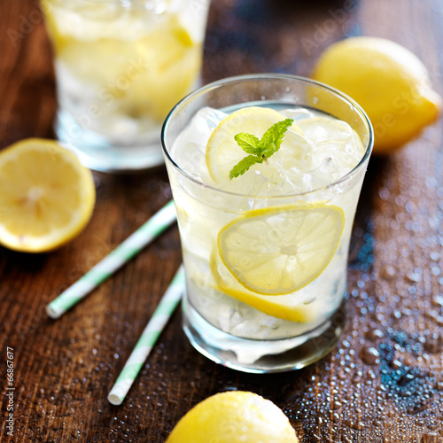 two glasses of lemonade shot close up