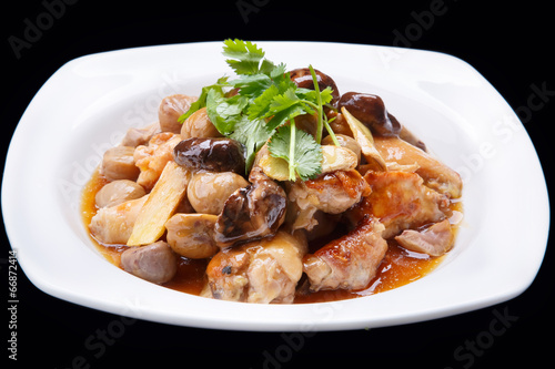 chinese stir fry chicken and mushroom isolated on black
