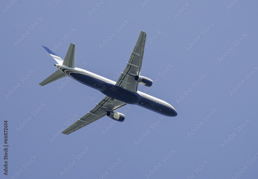 Flying plane on blue sky background Flying plane on blue sky background