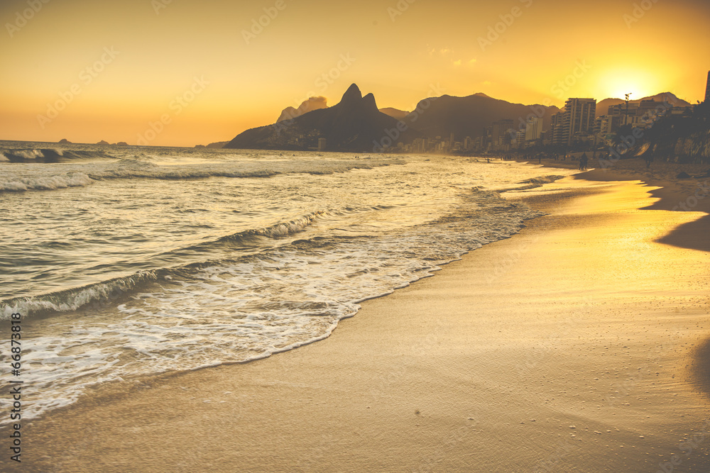 Warm Sunset on Ipanema Beach with People, Rio de Janeiro, Brazil Warm Sunset on Ipanema Beach with People, Rio de Janeiro, Brazil
