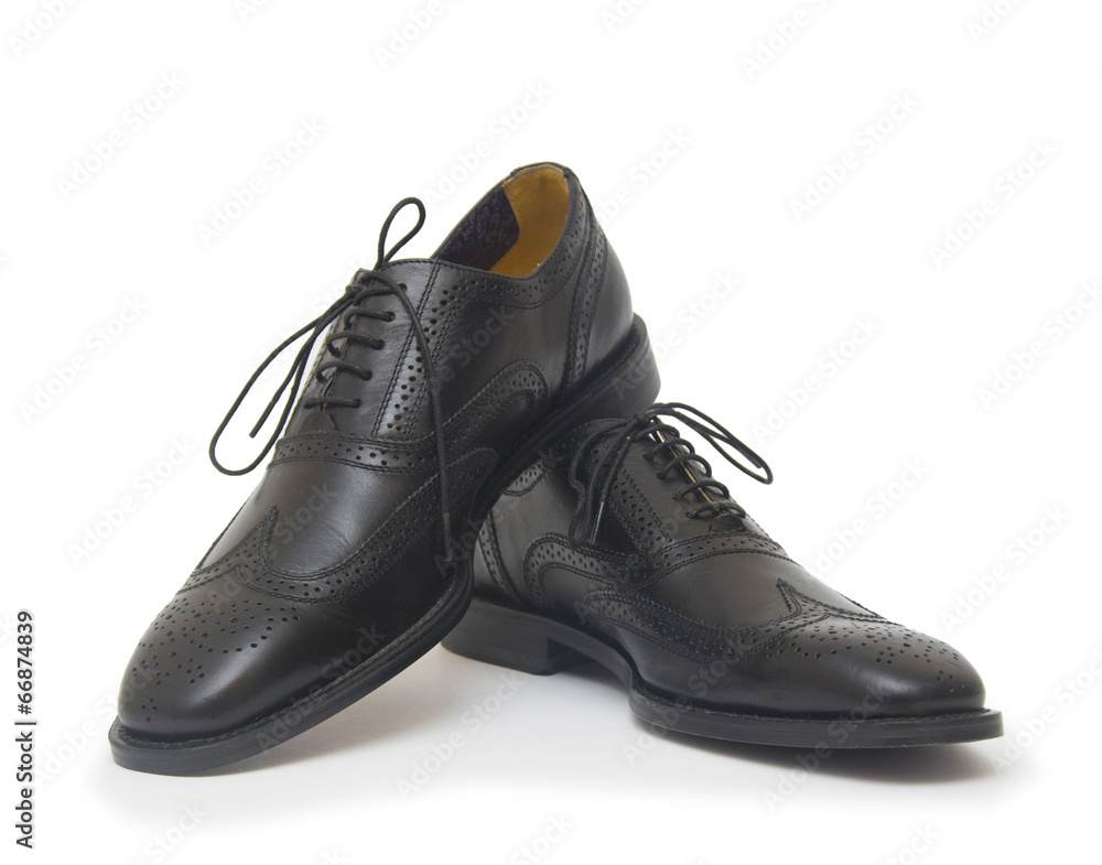 The black man's shoes isolated on white background. The black man's shoes isolated on white background.
