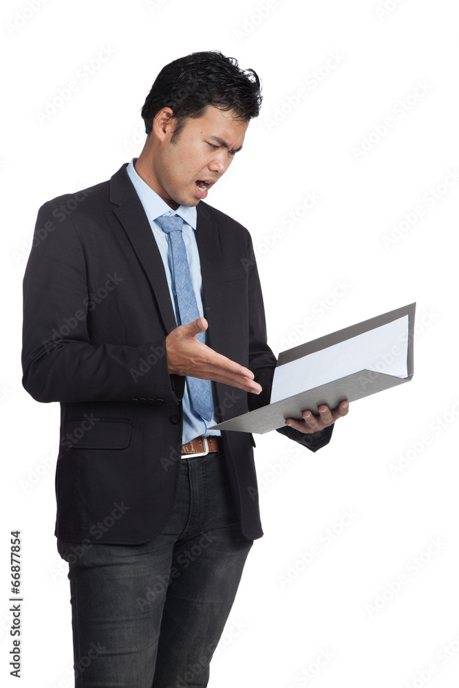 Asian businessman unhappy with a folder