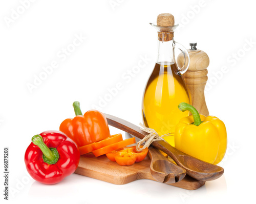 Colorful bell peppers and kitchen utensils