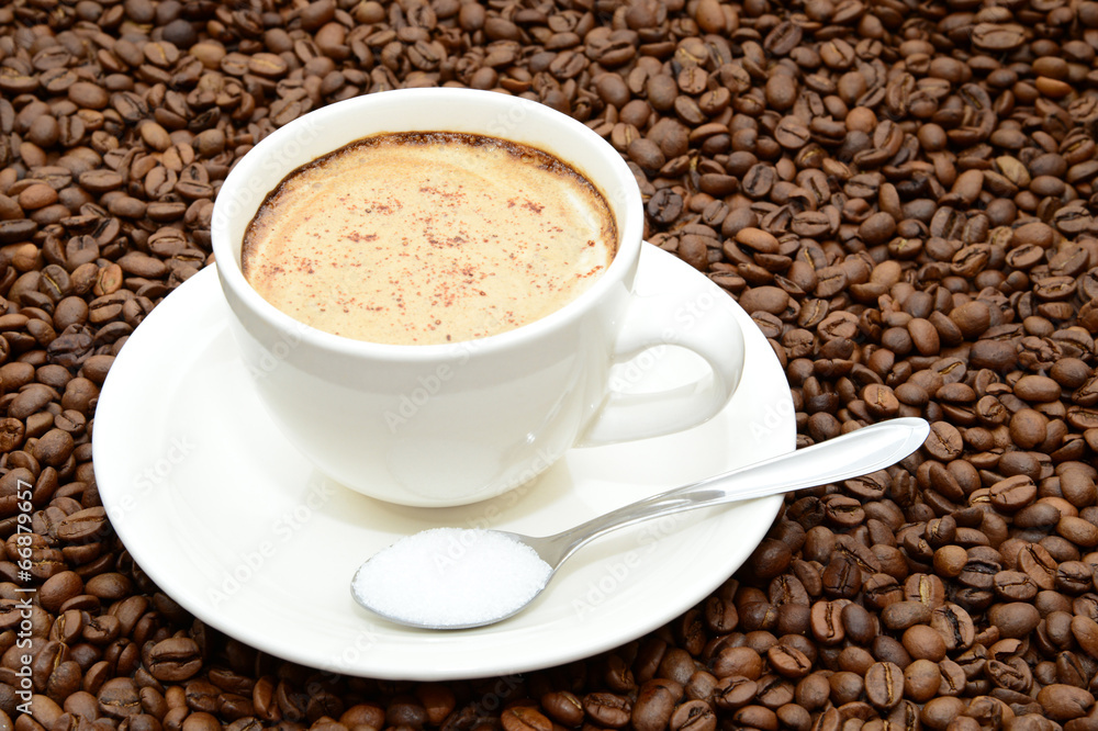 cup of coffee with cinnamon and a spoon of sugar cup of coffee with cinnamon and a spoon of sugar