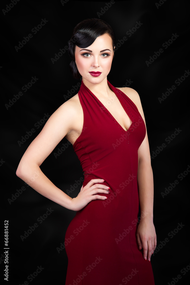Retro style brunette woman with hand on her waist Retro style brunette woman with hand on her waist