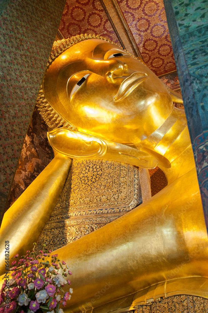 Face of Reclining Buddha gold statue at Wat Pho, Bangkok