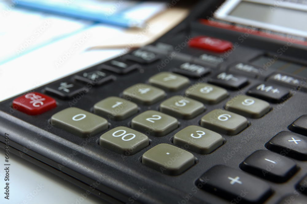 Calculator, pen, folder with documents, laptop Calculator, pen, folder with documents, laptop