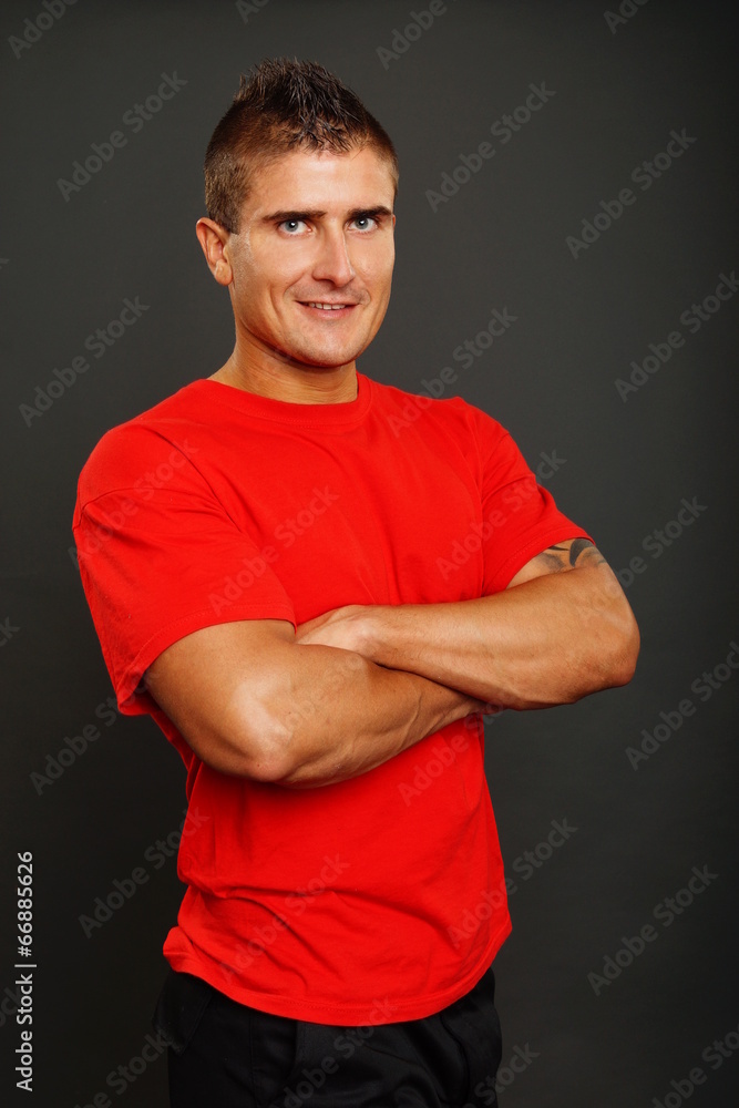 Portrait of young man in red shirt standing Portrait of young man in red shirt standing