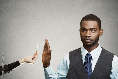 Portrait, headshot young business man says no to smoking