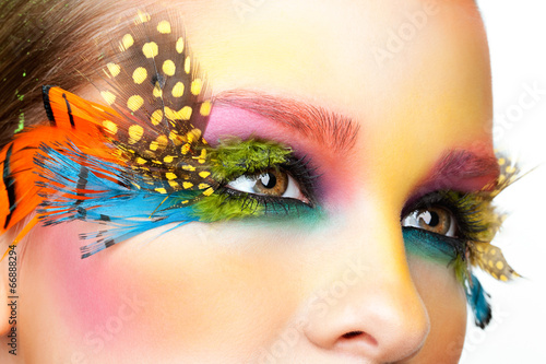 Woman with false feather ey...