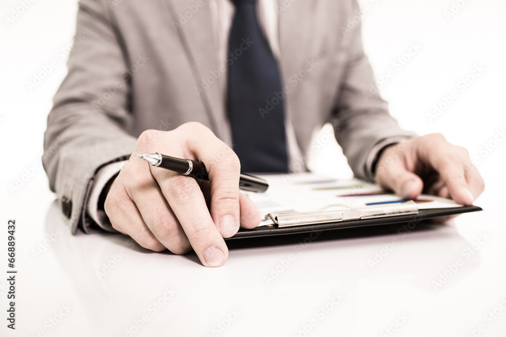 Businessman analyzing investment charts with laptop Businessman analyzing investment charts with laptop