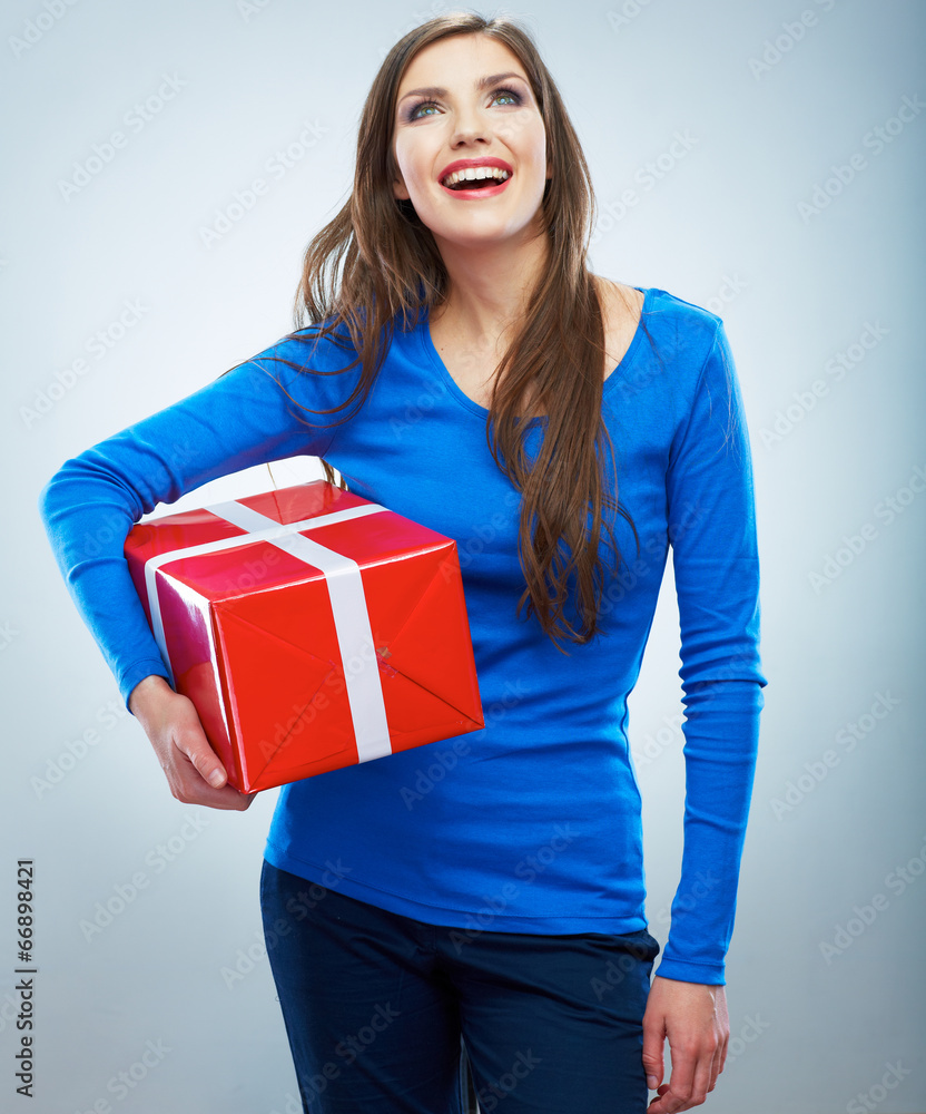 Portrait of young happy smiling woman hold red gift box. Isolat Portrait of young happy smiling woman hold red gift box. Isolat