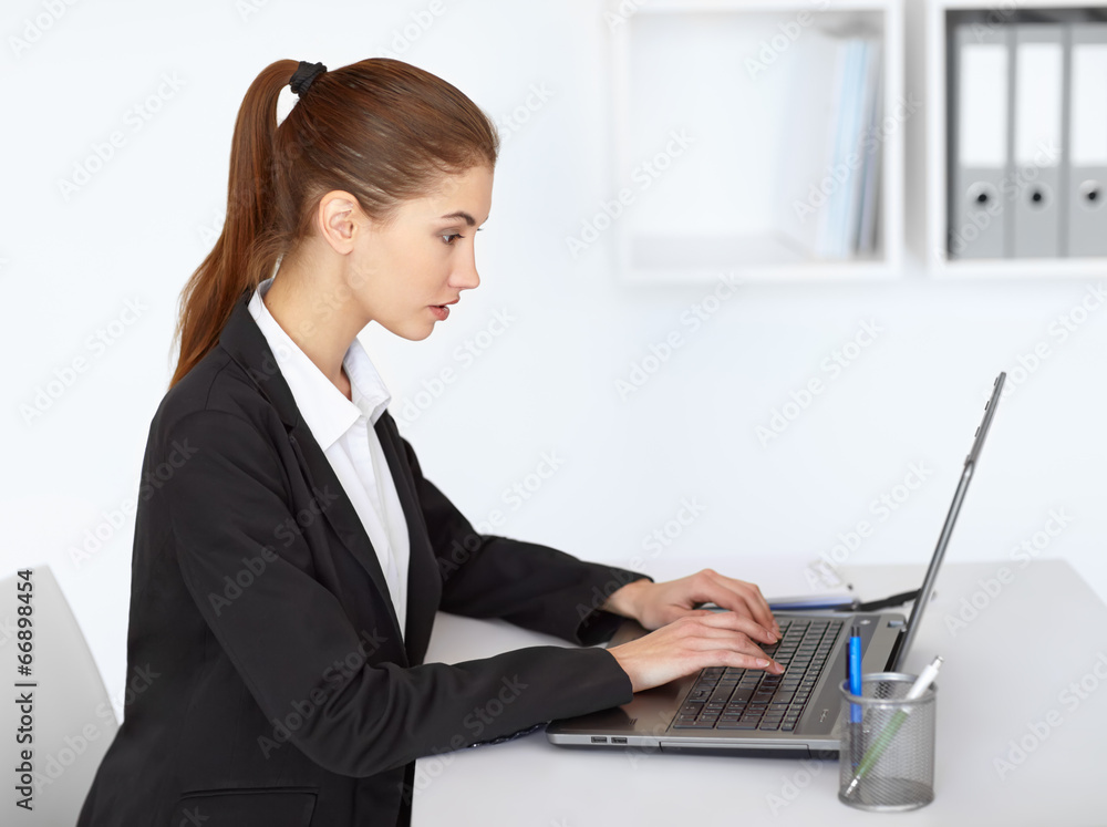 Businesswoman working at laptop Businesswoman working at laptop