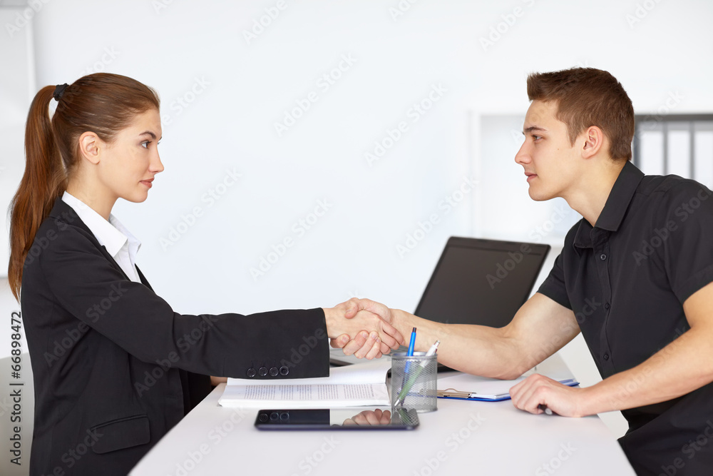 Two businesspeople shaking hands Two businesspeople shaking hands