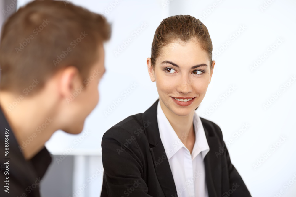 Businesspeople smiling each other Businesspeople smiling each other