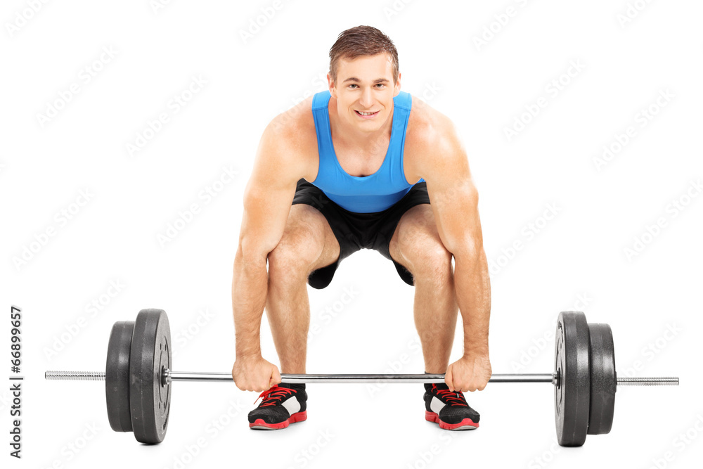 Fototapeta premium Weightlifting athlete lifting a barbell
