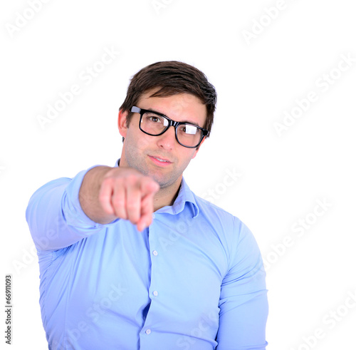 Portrait of handsome young man pointing to the camera isolated o