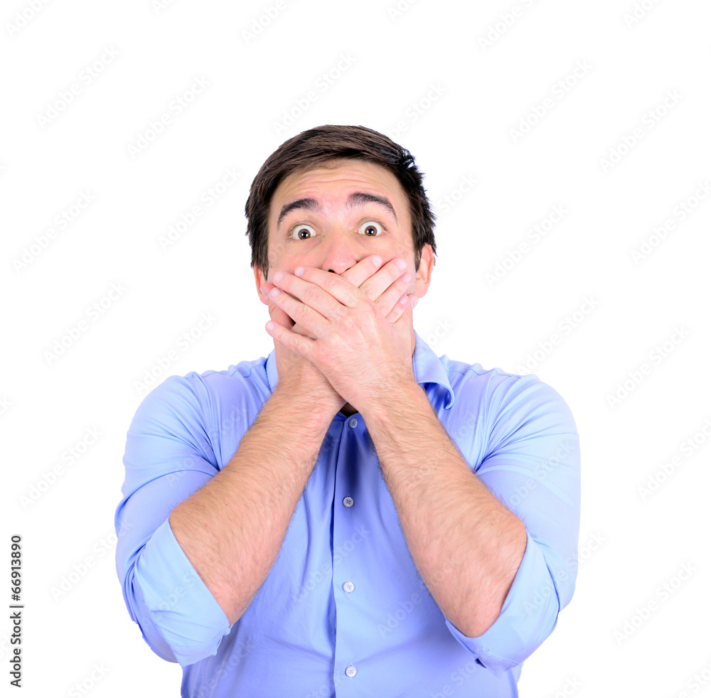 Portrait of young businessman making the speak no evil gesture Portrait of young businessman making the speak no evil gesture