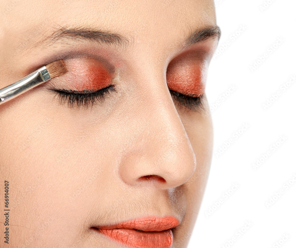 woman applying eye shadows