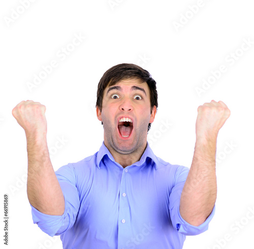 Successful man celebrating with arms up and shouting of joy isol