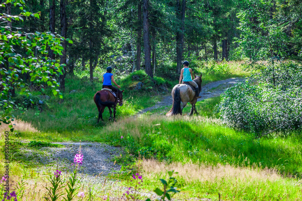 Argientere,France, young people sitting on horseback