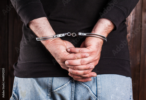 man hands in handcuffs © merydolla