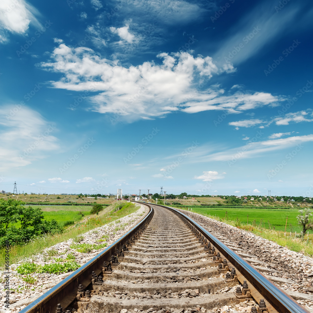 Fototapeta premium rail road to horizon under deep blue sky
