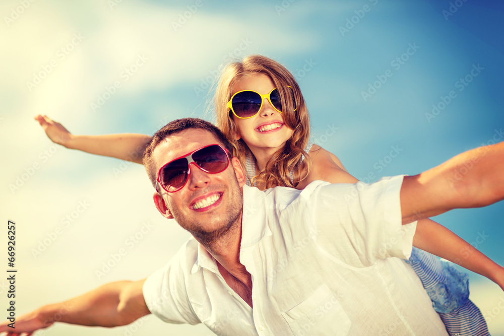 happy father and child in sunglasses over blue sky happy father and child in sunglasses over blue sky