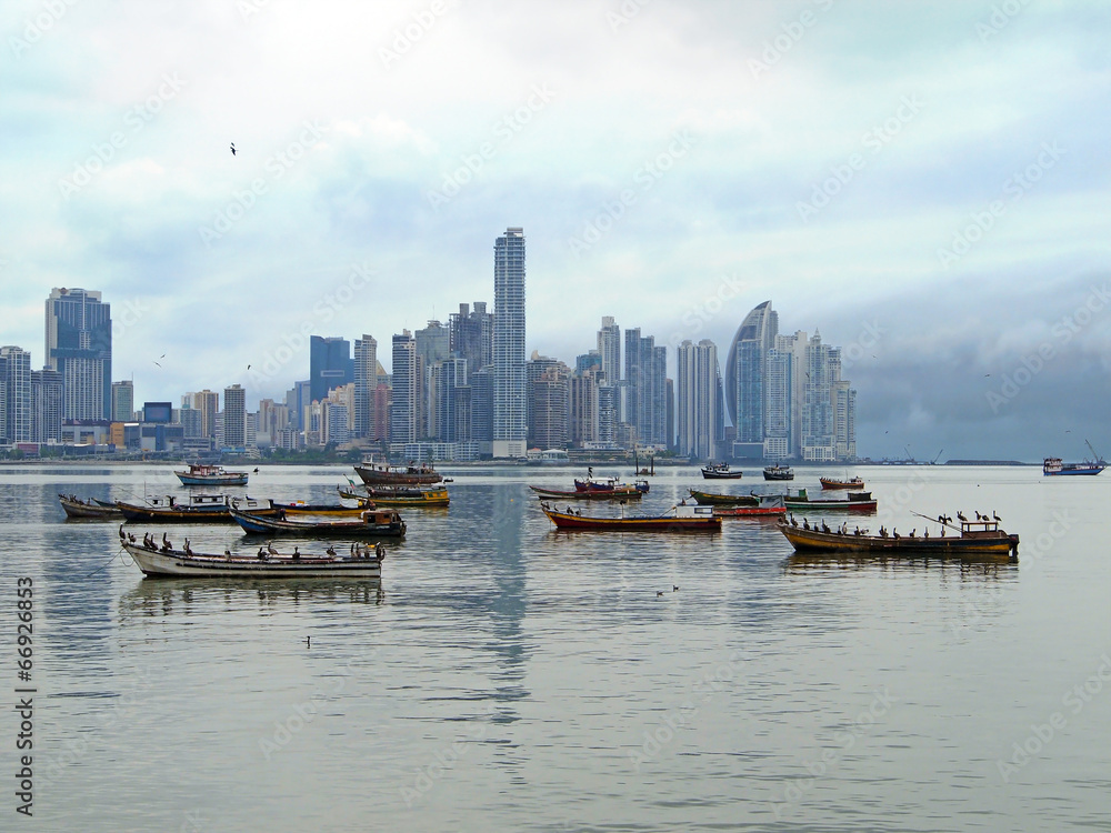 Skyscrapers and fishing boats