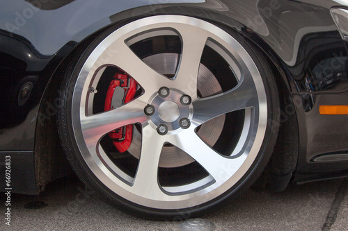 Sport car light alloy wheels © George Dolgikh